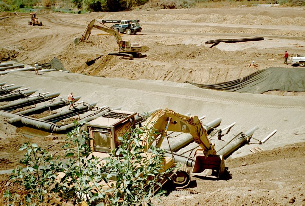 A photo of construction equipment building an infiltration gallery in the Tuolumne River.